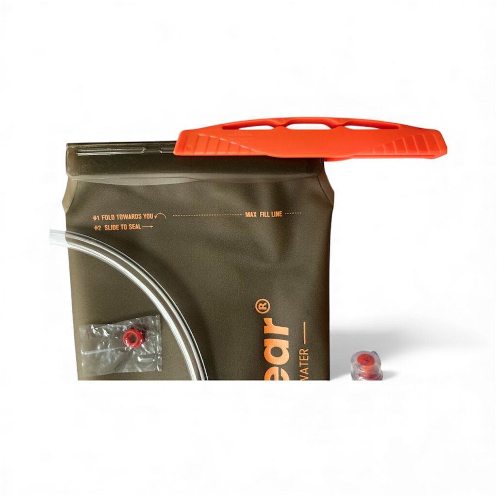 Pure Clear® 2 Litre Hydration Bladder with orange lid and drinking tube, designed for outdoor activities and hands-free hydration.