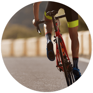 Cyclist riding a road bike, showcasing active outdoor lifestyle, relevant to Pure Clear Filters' water filtration solutions for cycling and other activities.